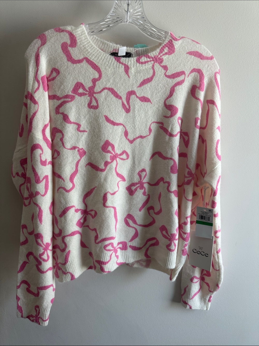 NWT CeCe Cream Crewneck Sweater with Pink Ribbon Motif. Size L